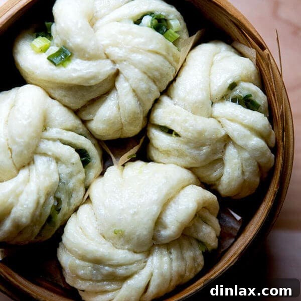A steamer filled with Chinese steamed scallion buns.