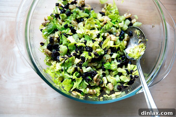 A large ceramic bowl filled with the freshly prepared celery-walnut salsa, vibrant and inviting, showcasing its diverse textures.