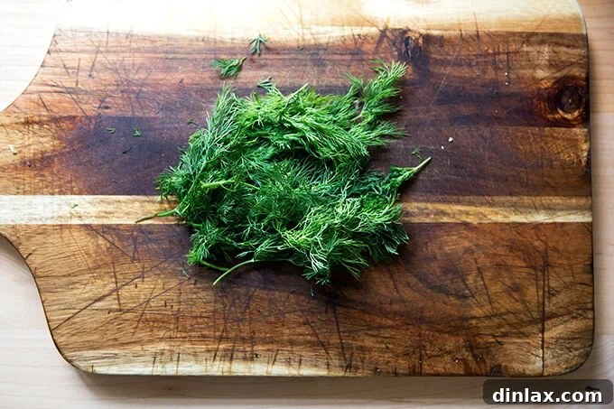 Margaret Roach: Soup, Stories, and So Much More 8 A bowl of soup, generously garnished with a vibrant sprig of fresh dill, adding a herbaceous touch.