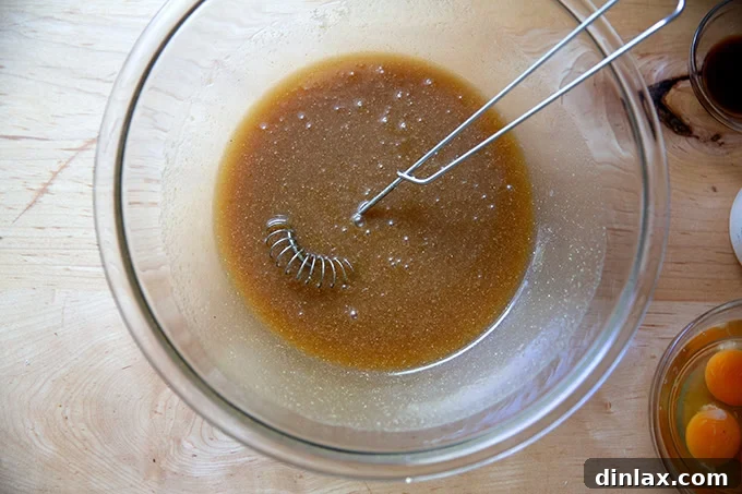 Sister Pie's Irresistible Salted Maple Pie 7 A close-up of a bowl where brown sugar, maple syrup, melted butter, cornmeal, and salt have been perfectly whisked into a smooth, homogeneous mixture.