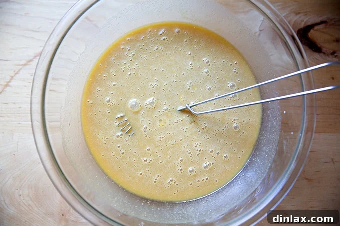 Sister Pie's Irresistible Salted Maple Pie 10 The final whisked custard mixture for salted maple pie, showing a perfectly smooth and rich consistency, ready to be poured into the pie shell.