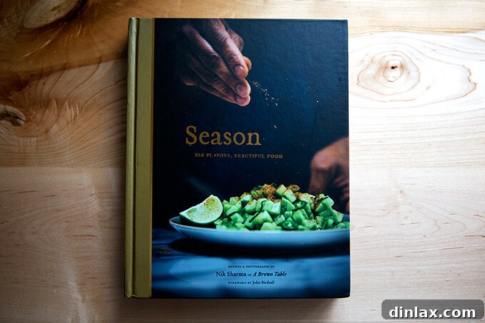 Nik Sharma's Season cookbook: not a traditional Indian cookbook but a collection of recipes influenced by an upbringing in Bombay and an acclimation to America from the perspective of a gay immigrant, offering unique culinary fusions.