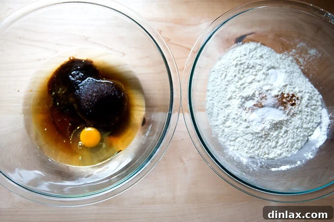 Harvest Apple Muffins 4 Image demonstrating the two-bowl mixing method, with a whisk and spatula on a counter, ready for muffin batter preparation.