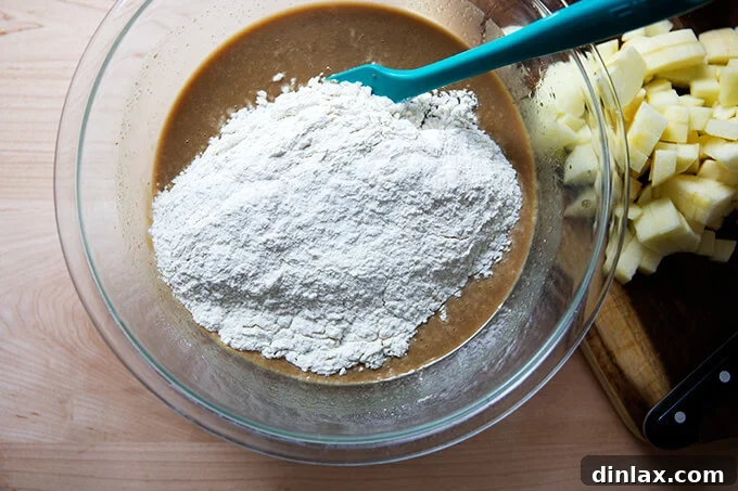 Harvest Apple Muffins 6 The moment dry ingredients are added to the wet mixture, ready for gentle incorporation to prevent overmixing.