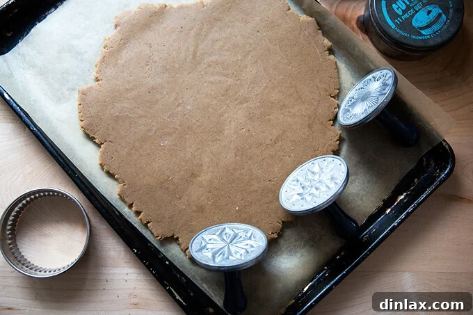 Brown Butter Muscovado Stamped Christmas Cookies 9 Nordic Ware Starry Night Cookie Stamp Set aside rolled out cookie dough on a sheet pan.
