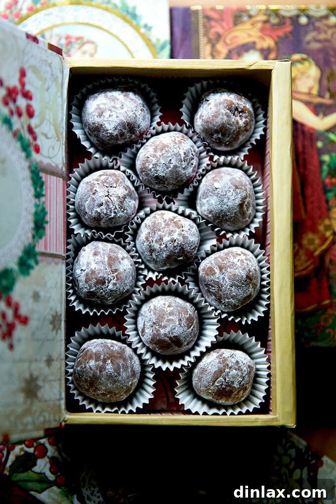 Quick and Boozy Holiday Rum Ball Delight 15 An elegantly arranged gift box brimming with chocolate rum balls, perfectly presented for a holiday offering.