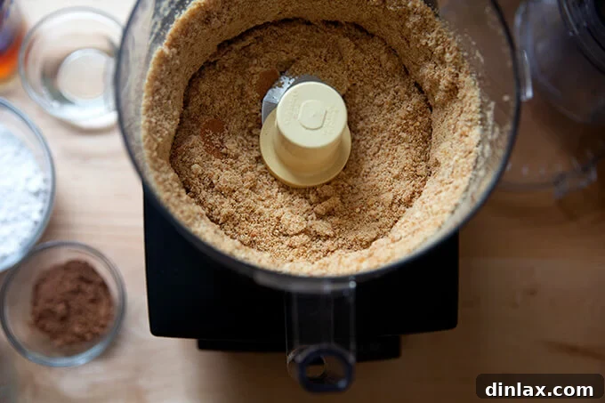 Quick and Boozy Holiday Rum Ball Delight 6 Finely ground vanilla wafer crumbs in a food processor, forming the base for the rum ball mixture.