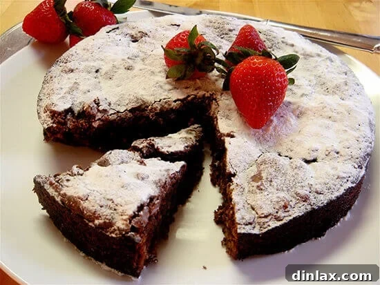 A beautifully baked flourless chocolate cake, ready to be served.
