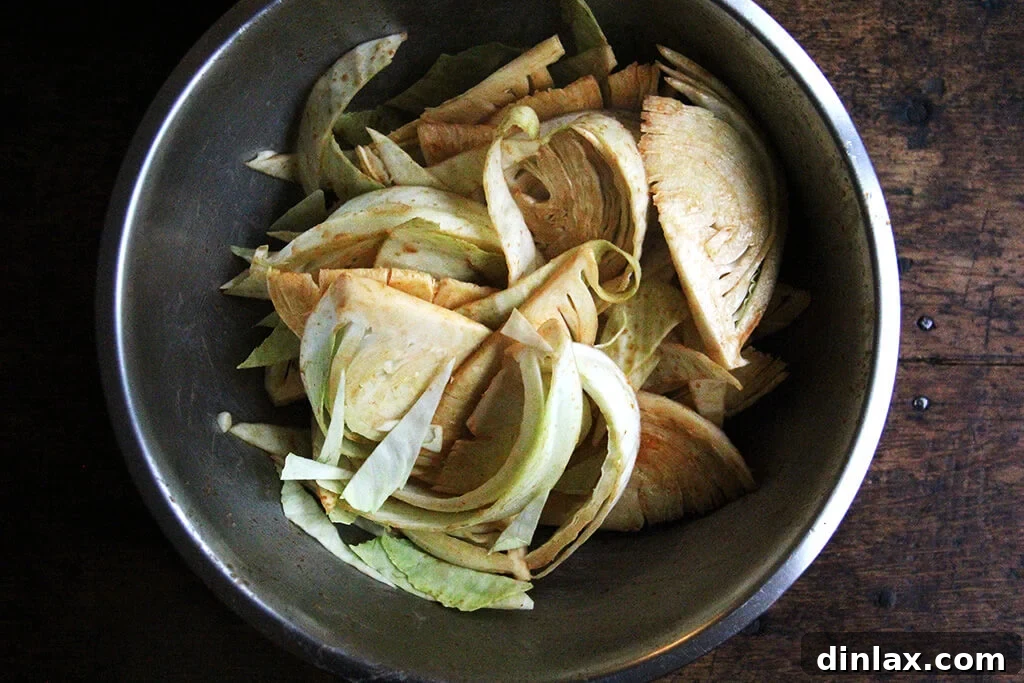 Golden Roast Chicken with Caramelized Cabbage 4 A bowl of cabbage wedges tossed in dressing.
