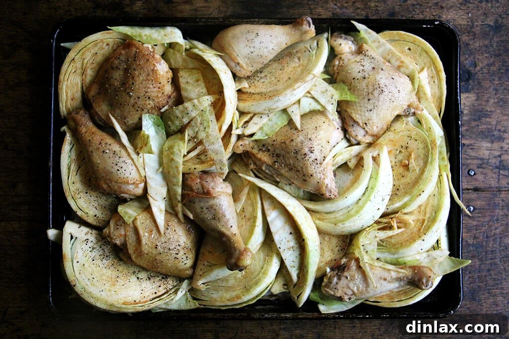 Golden Roast Chicken with Caramelized Cabbage 5 A sheet pan of cabbage and chicken legs.