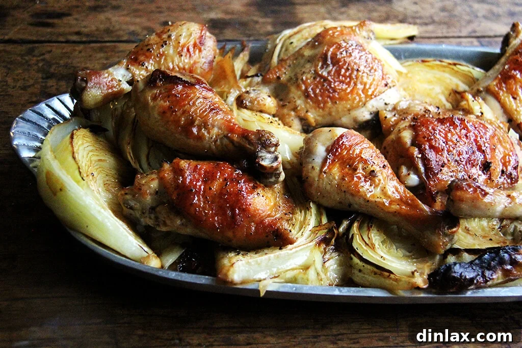 Golden Roast Chicken with Caramelized Cabbage 10 Sideview of a platter of sheet pan roast chicken and cabbage.