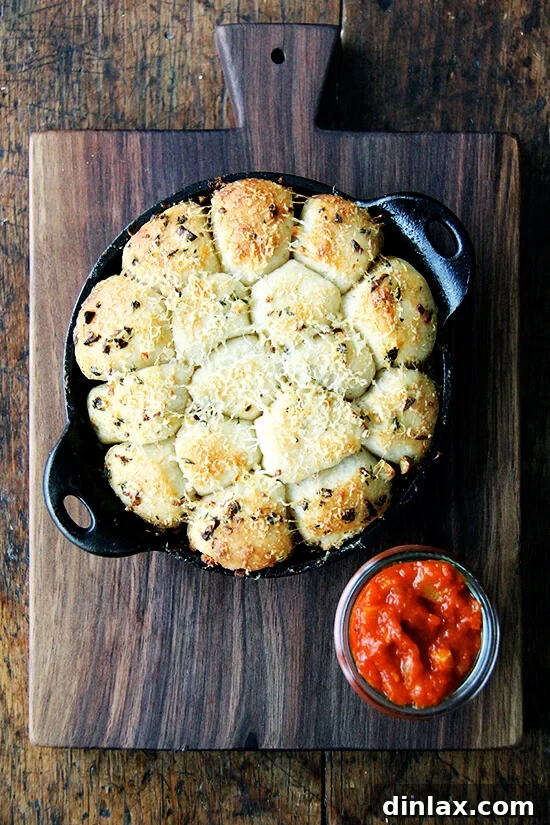 Sparkling Bites: Your Go-To Guide for New Year's Eve Appetizers 6 Savory Garlic and Thyme Monkey Bread with Spicy Marinara Sauce