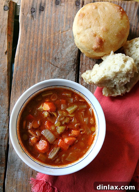 A wholesome bowl of hearty vegan lentil soup, perfectly seasoned and ready to enjoy with a side of homemade bread. This complete and healthy meal is packed with nutrients and flavor. alexandracooks.com