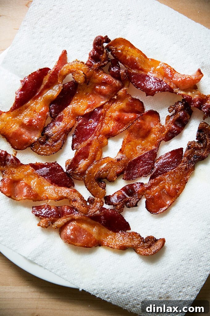 Crispy oven-baked bacon on a sheet pan for a delicious breakfast