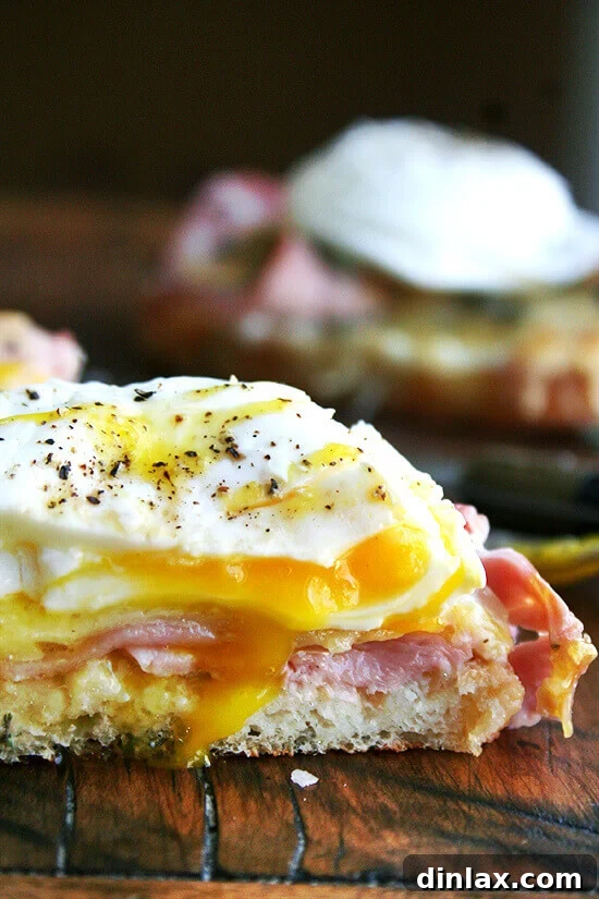 Classic Croque Monsieur sandwich topped with a perfectly poached egg.