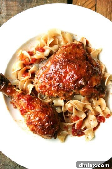 Braised Chicken with Sherry & Sherry Vinegar, presented on a plate with sauce, ready to be served as a comforting Sunday dinner.