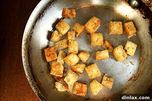 Crispy olive oil fried bread cubes, a perfect crunchy topping for creamy soups