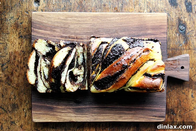 A slice of Holly's Babka revealing beautiful swirls of chocolate filling within the soft bread.