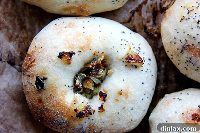 Freshly baked Overnight Bialys with their characteristic dimpled centers filled with caramelized onions.