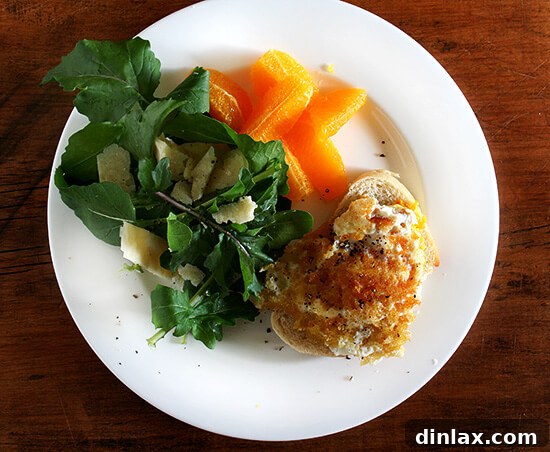 Egg on toast with arugula and oranges Perfectly cooked fried egg on toast, garnished with fresh arugula and vibrant orange segments, embodying a wholesome and delicious meal.