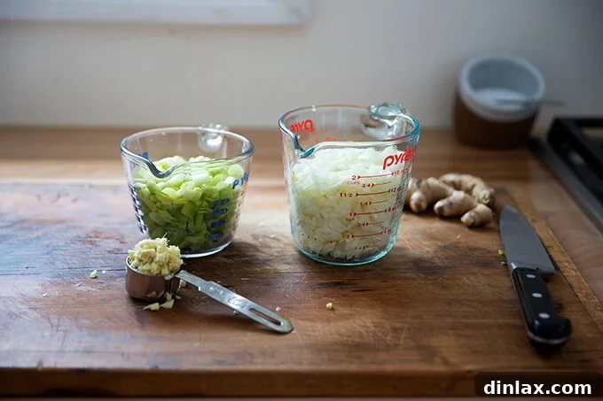 Curried Carrot Ginger Coconut Bliss 6 Finely chopped onions, celery, and fresh ginger, forming the aromatic base of the soup.
