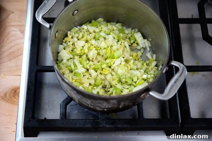 Curried Carrot Ginger Coconut Bliss 7 Celery, onions, and ginger gently sweating in olive oil in a pot, becoming soft and translucent.