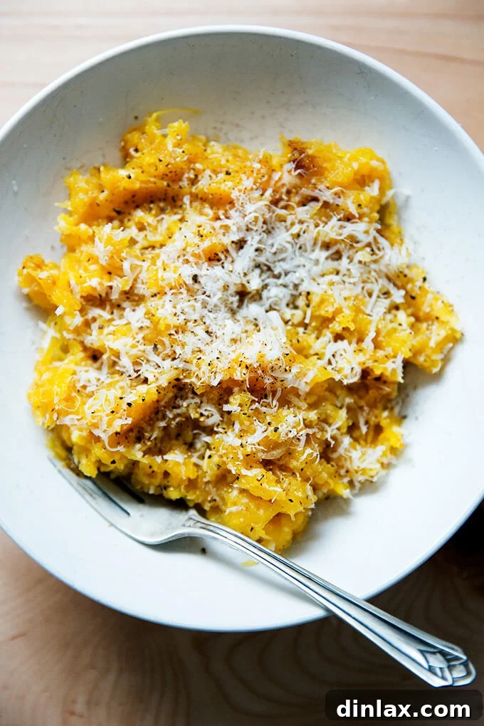 A serving of Cacio e Pepe spaghetti squash, showcasing the beautiful pasta-like texture of the squash.