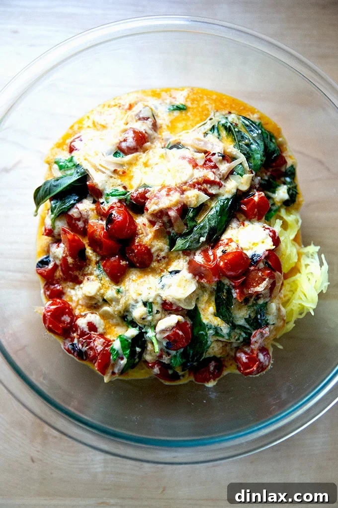 Spaghetti squash generously tossed with creamy baked feta and juicy roasted cherry tomatoes.