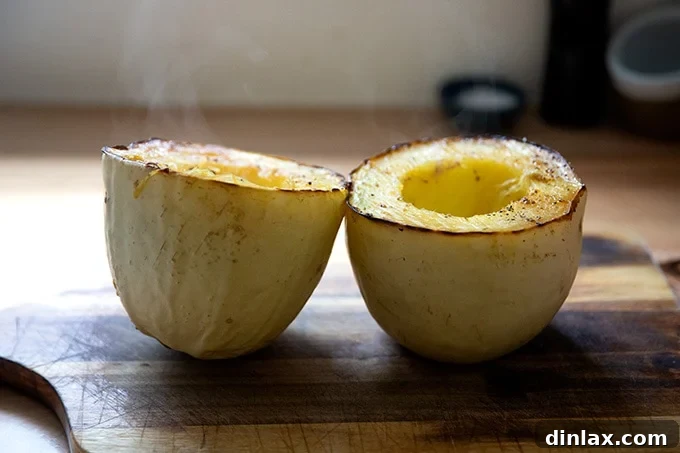 A halved spaghetti squash, with seeds removed, showing the distinctive crosswise cut.