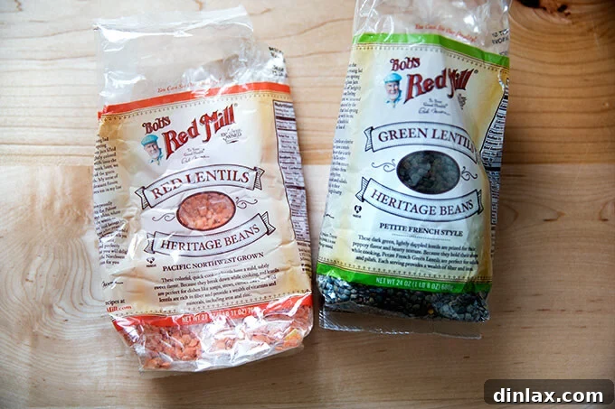 Creamy Coconut Kale Lentil Curry 4 Two bags of lentils, red and French green, displayed on a surface, highlighting the chosen varieties for the recipe.