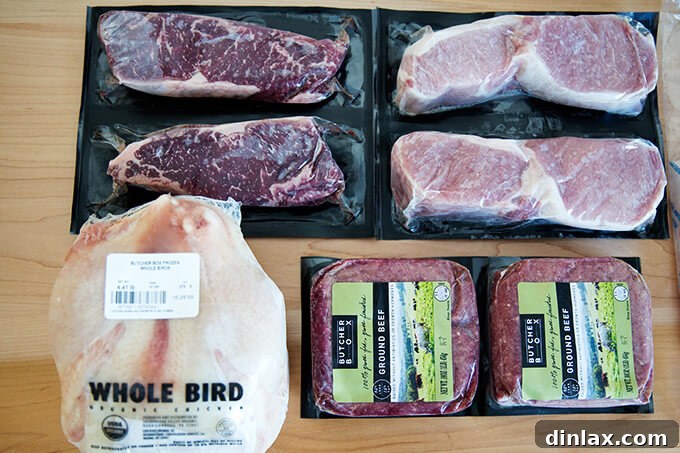 ButcherBox: Ethical Meats Straight to Your Door 5 Contents of a ButcherBox delivery, showcasing individually packaged, frozen cuts of various meats like ground beef, chicken, and steaks. Premium meat ready for the freezer.