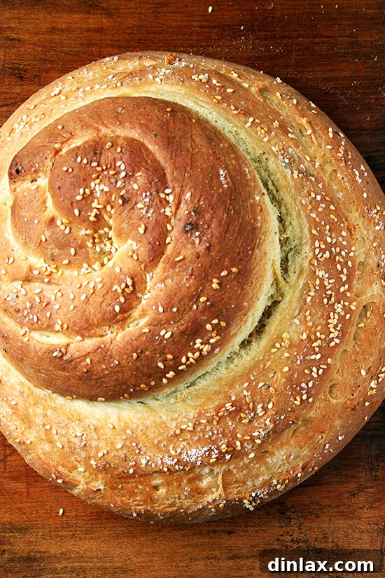 Rustic Rosemary Semolina Bread A rustic and inviting Rosemary Semolina Bread, freshly baked with a golden, crisp crust, reflecting the quality of olive oil and semolina flour from Macrina Bakery's inspiration.