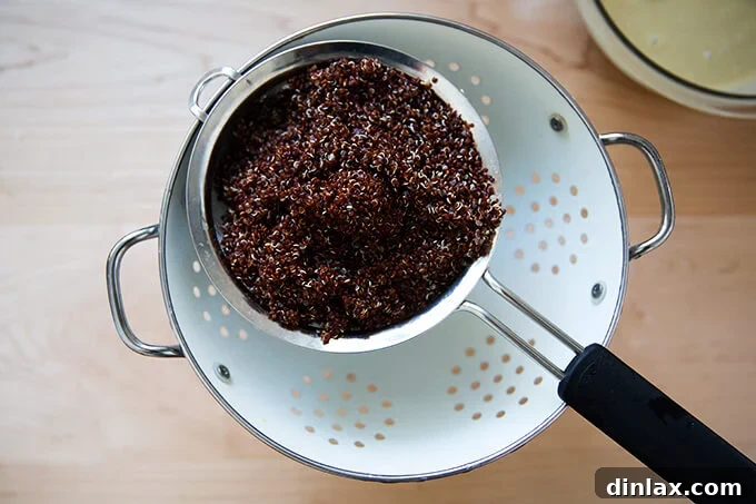 Vibrant Carrot Quinoa Salad with Tangy Tahini Dressing 7 Cooked quinoa, drained and ready to be added to the salad