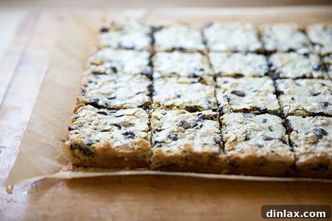 Slicing cooled gooey oat bars, made easier by chilling