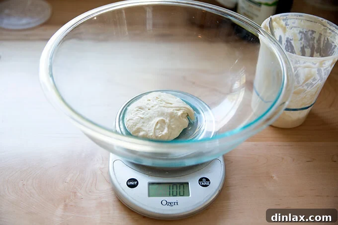 The Easiest Sourdough Focaccia: Perfect for Beginners 8 Weighing out 100g of active sourdough starter with a digital kitchen scale