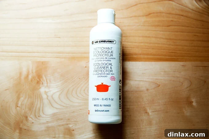Restore Your Le Creuset Cookware's Luster 4 A bottle of official Le Creuset enameled cast iron pan cleaner, designed for safe and effective cleaning