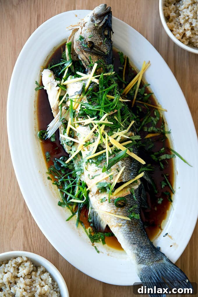 Ginger-Scallion Infused Steamed Whole Fish 2 Chinese-style whole Branzino with ginger, scallions and soy sauce, a truly delicious and restaurant-quality dish.