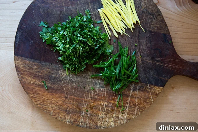 Ginger-Scallion Infused Steamed Whole Fish 5 Finely slivered ginger, scallions, and cilantro for the finishing touches and garnish.