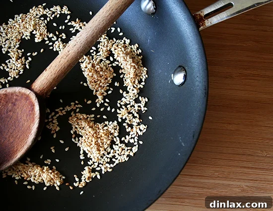 Velvety Tofu with a Garlic Kick 4 Sesame seeds toasting gently in a skillet, turning golden brown.