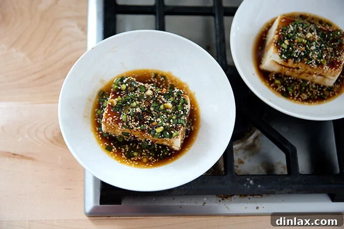 Velvety Tofu with a Garlic Kick 8 Two bowls of warm tofu generously topped with the rich, spicy sesame-scallion sauce.