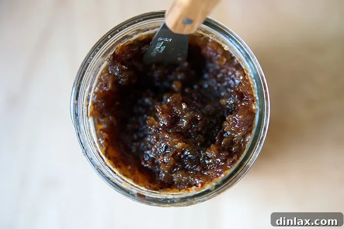 Versatile Apple Chutney Brightened with Ginger and Lemon 8 Freshly prepared homemade apple chutney recipe in a beautifully presented glass mason jar, ready for refrigeration or further preservation.