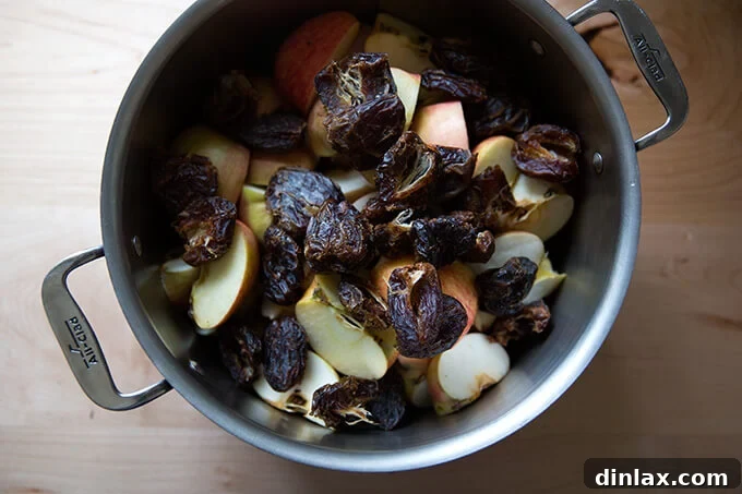 Apples and dates in a pot, ready to simmer