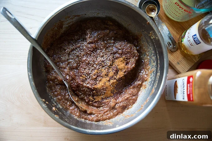 Seasoning the apple-date butter purée with spices, lemon, and vinegar