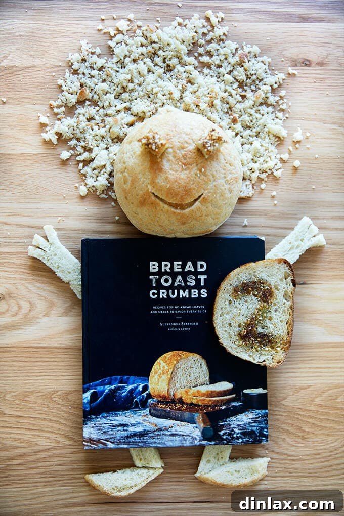 Bread Toast Crumbs' Second Anniversary: 15 Must-Try Web Recipes 2 Freshly baked no-knead peasant bread with golden crust and scattered crumbs, symbolizing the essence of Bread Toast Crumbs cookbook