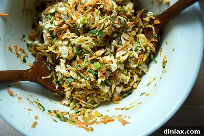 The fully mixed chopped Thai satay salad, showcasing the even distribution of ingredients and dressing, ready to be served.