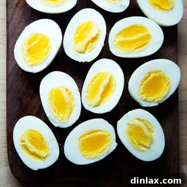 Six Perfect Instant Pot hard-boiled eggs, halved and ready to serve, showcasing their ideal texture.
