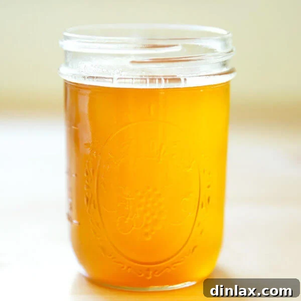 A beautifully clear jar of golden homemade ghee.