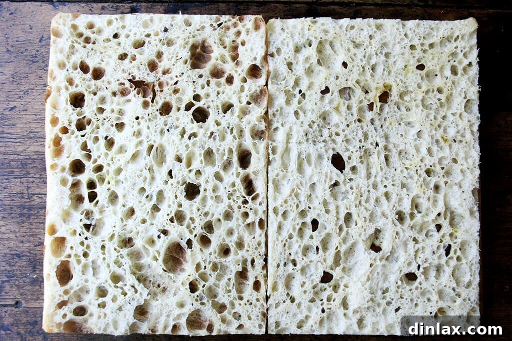 Ultimate Sheet Pan Breakfast Slab Sandwich: Bacon, Egg, and Cheese 11 A sheet pan with halved focaccia