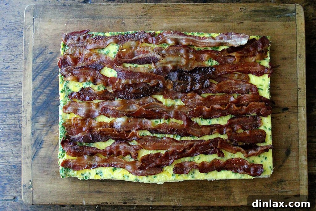 Ultimate Sheet Pan Breakfast Slab Sandwich: Bacon, Egg, and Cheese 12 Adding the bacon to the sheet pan sandwich.