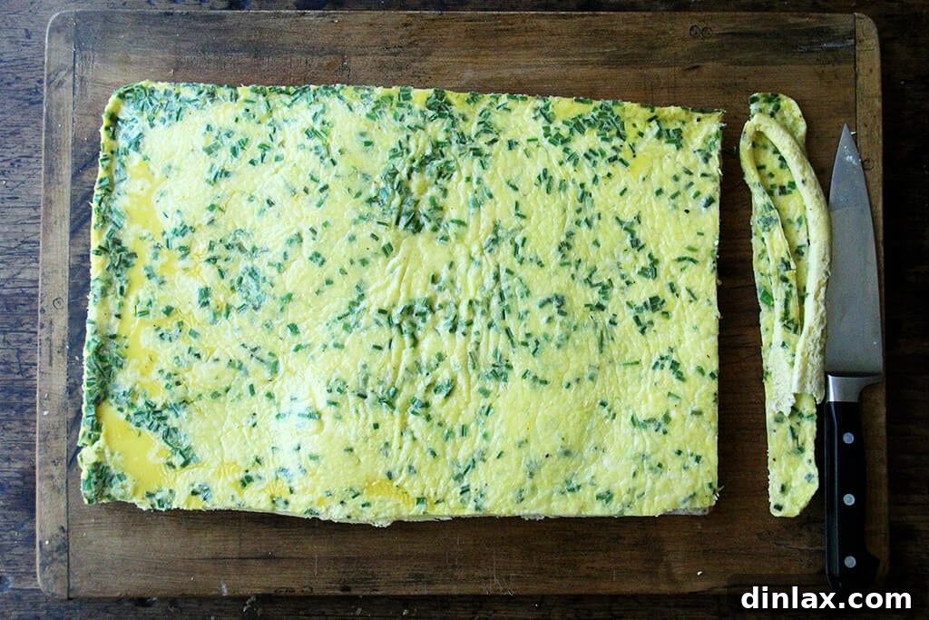 Ultimate Sheet Pan Breakfast Slab Sandwich: Bacon, Egg, and Cheese 6 A cutting board with sheet pan eggs.